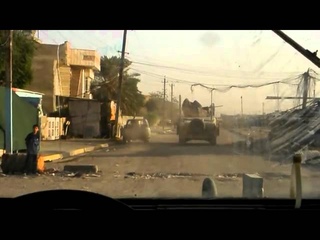 IED detonates next to gun truck