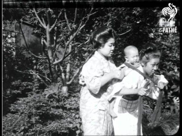 Japanese Baby Being Carried On Mothers Back